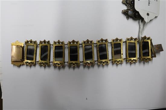 Two banded agate bracelets, one in gilt metal, one in white metal.